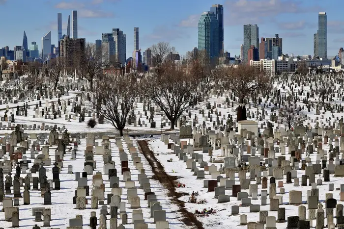 snow in a cemetery in Queens